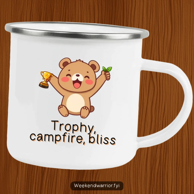 Funny camping mug with a joyful bear cub character holding a leaf trophy, perfect for celebrating wins in the great outdoors.
