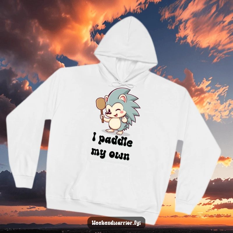Funny hedgehog hoodie featuring a smiling hedgehog character ready for action with a small paddle, ideal for cold weather.