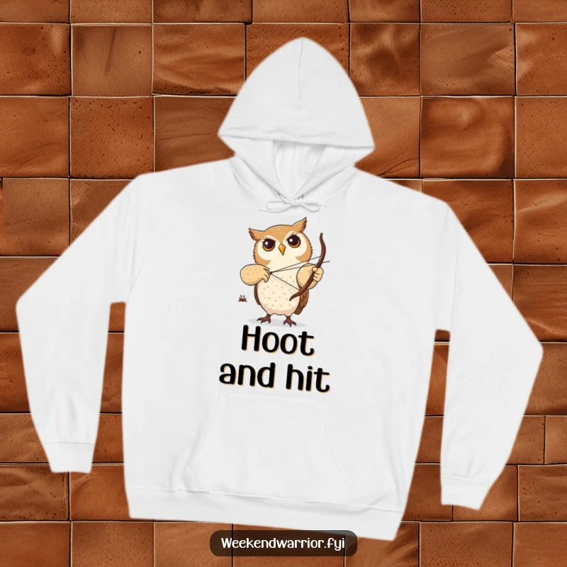 Funny hoodie with a focused owl character practicing archery with a small twig bow, offering warmth and a symbol of precision.