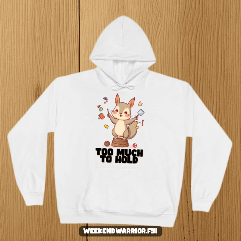 Funny hoodie featuring a squirrel in mid-juggle, balancing with comical intensity on a unstable surface, looking quite pleased.