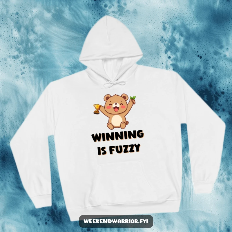 Funny hoodie with a joyful bear cub character proudly holding a leaf trophy, perfect for comfortable celebration.