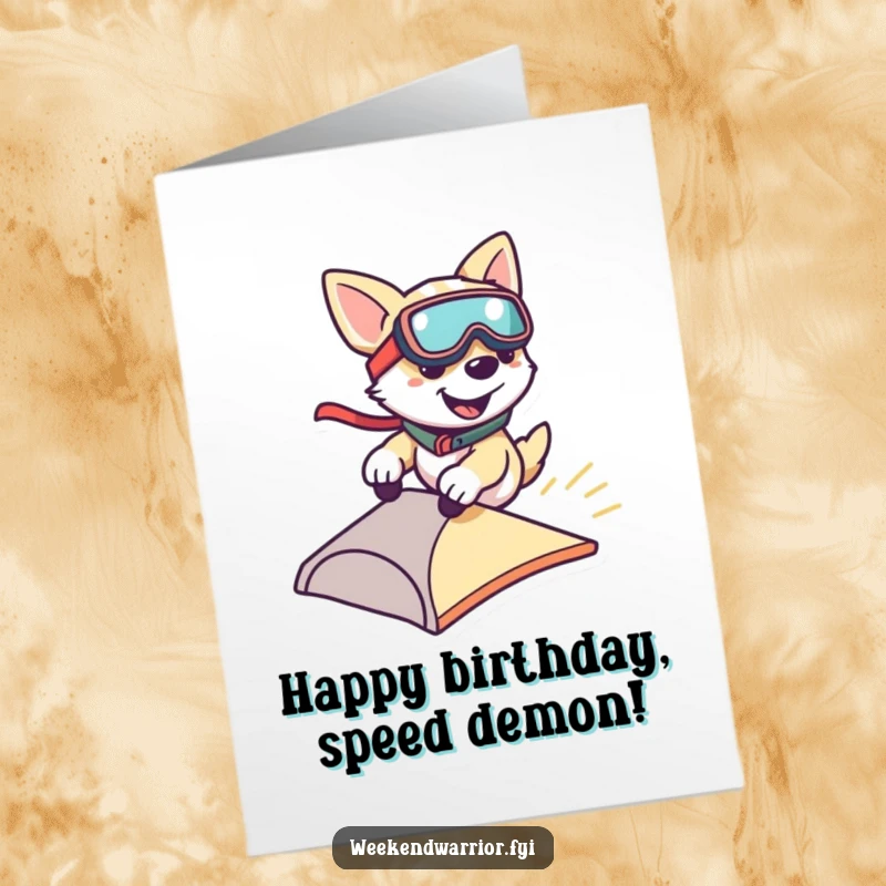 Funny Free Printable Birthday Card: A smiling dog wearing goggles zooms down a small ramp, celebrating a birthday with speed and fun.