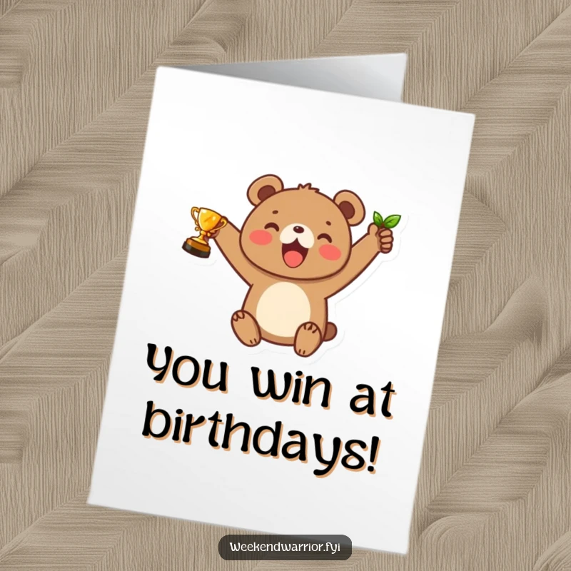 Funny Free Printable Birthday Card: Cute bear cub joyfully holds up a leaf trophy, celebrating a victory.