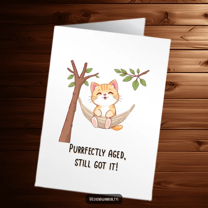 Funny Free Printable Birthday Card: A kawaii cat skillfully sets up a miniature hammock between two branches, embodying pure relaxation for a special day.