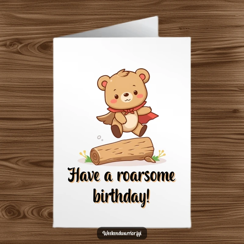 Funny Free Printable Birthday Card: A cute bear cub in a cape leaps heroically over a tiny log, celebrating with joy.