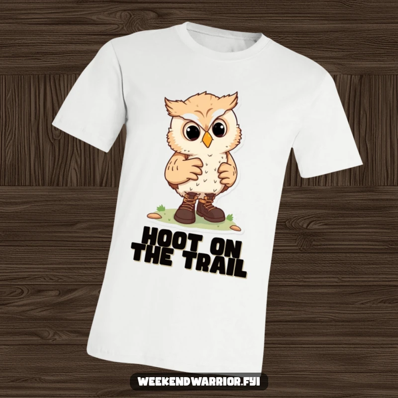 Funny t-shirt showcasing a curious owl character adjusting hiking boots, symbolizing a love for adventure and the wilderness.