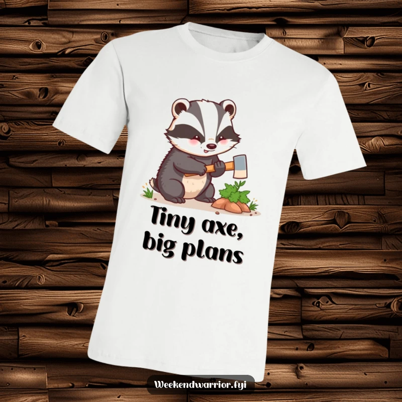 Funny kawaii badger enthusiastically hacking a small bush with a tiny axe, printed on a comfortable t-shirt. A humorous nature design.