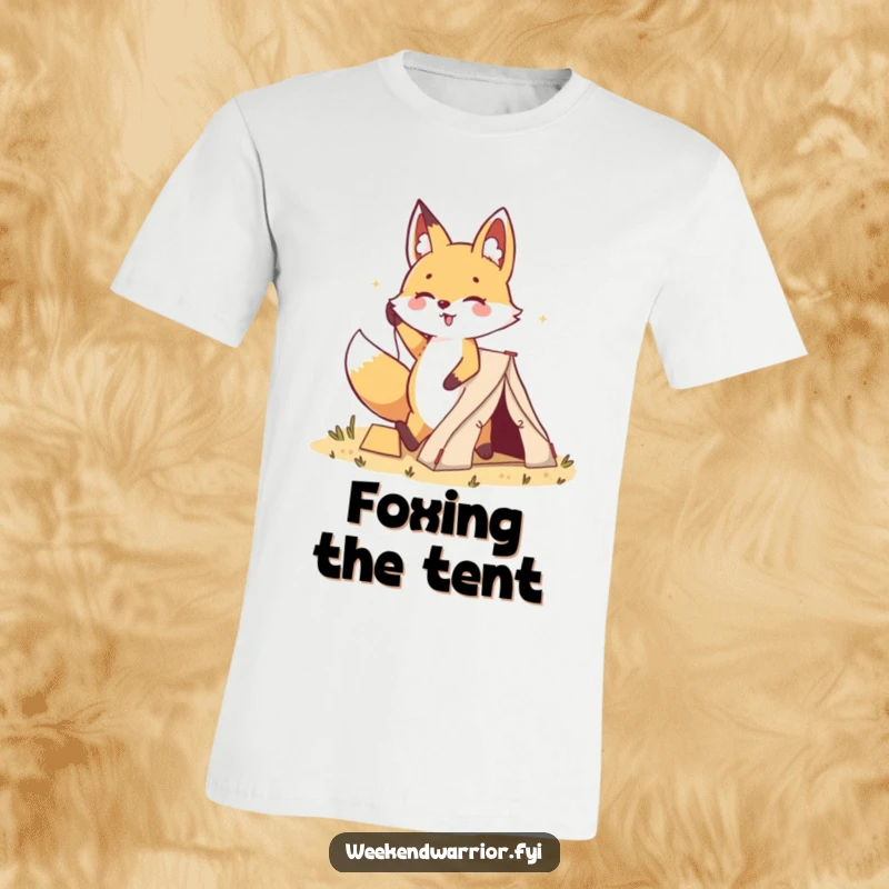 Funny Kawaii Fox Tent T-Shirt: A cheerful cartoon fox proudly hammers a stake for a small tent, with a happy stride and a determined look.