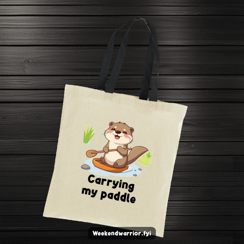 Funny tote bag with a joyful otter holding a paddle and enthusiastically navigating a tiny stream, great for carrying items.