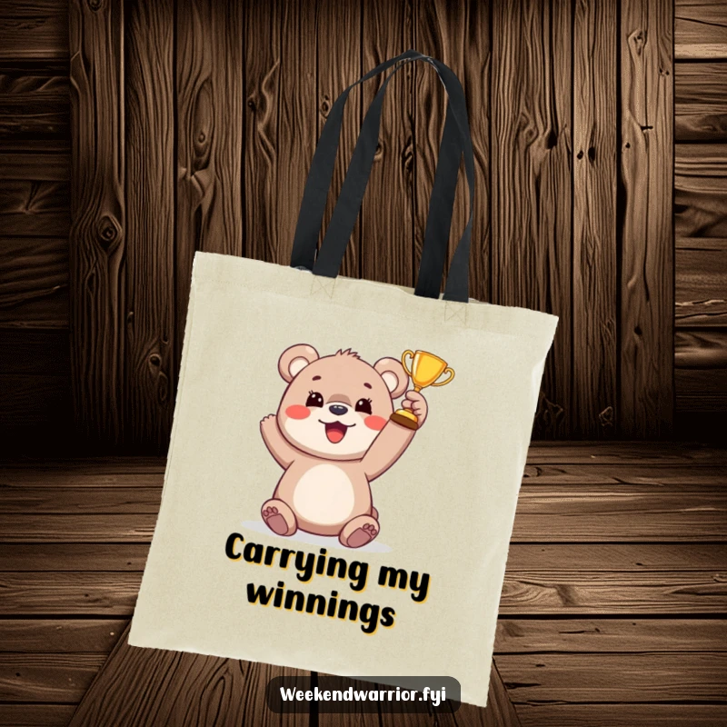 Funny bear cub trophy tote bag featuring a happy cub raising a small trophy, a symbol of small victories and joy.